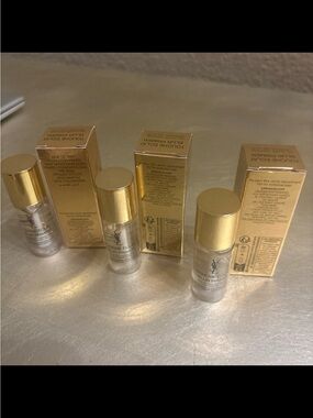 Yves Saint Laurent Blur Primer Bottles in Gold and Clear